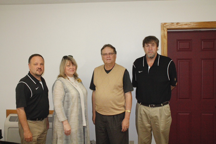 Photo by Greg Bird Superintendent Mike Cash, MCHS Principal Sharon Privett and AD Robert Jones announced the hiring of Jimmy Voight (2nd from right) as new Head Coach for Raiders Basketball this week.